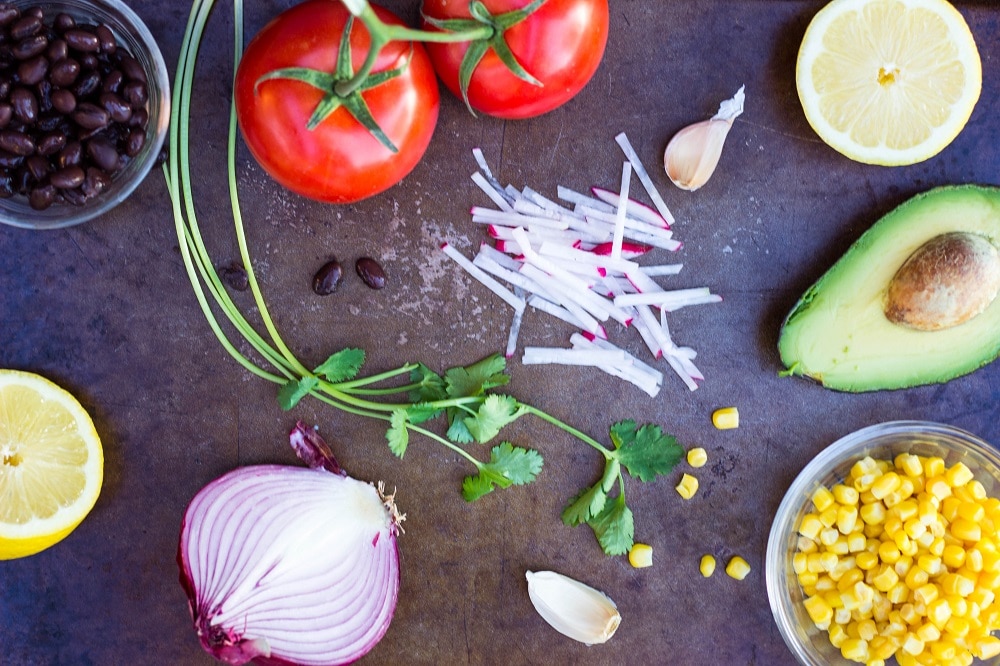 Guacamole ingredients on a tray for Roasted Potato. Cups with Loaded Guacamole