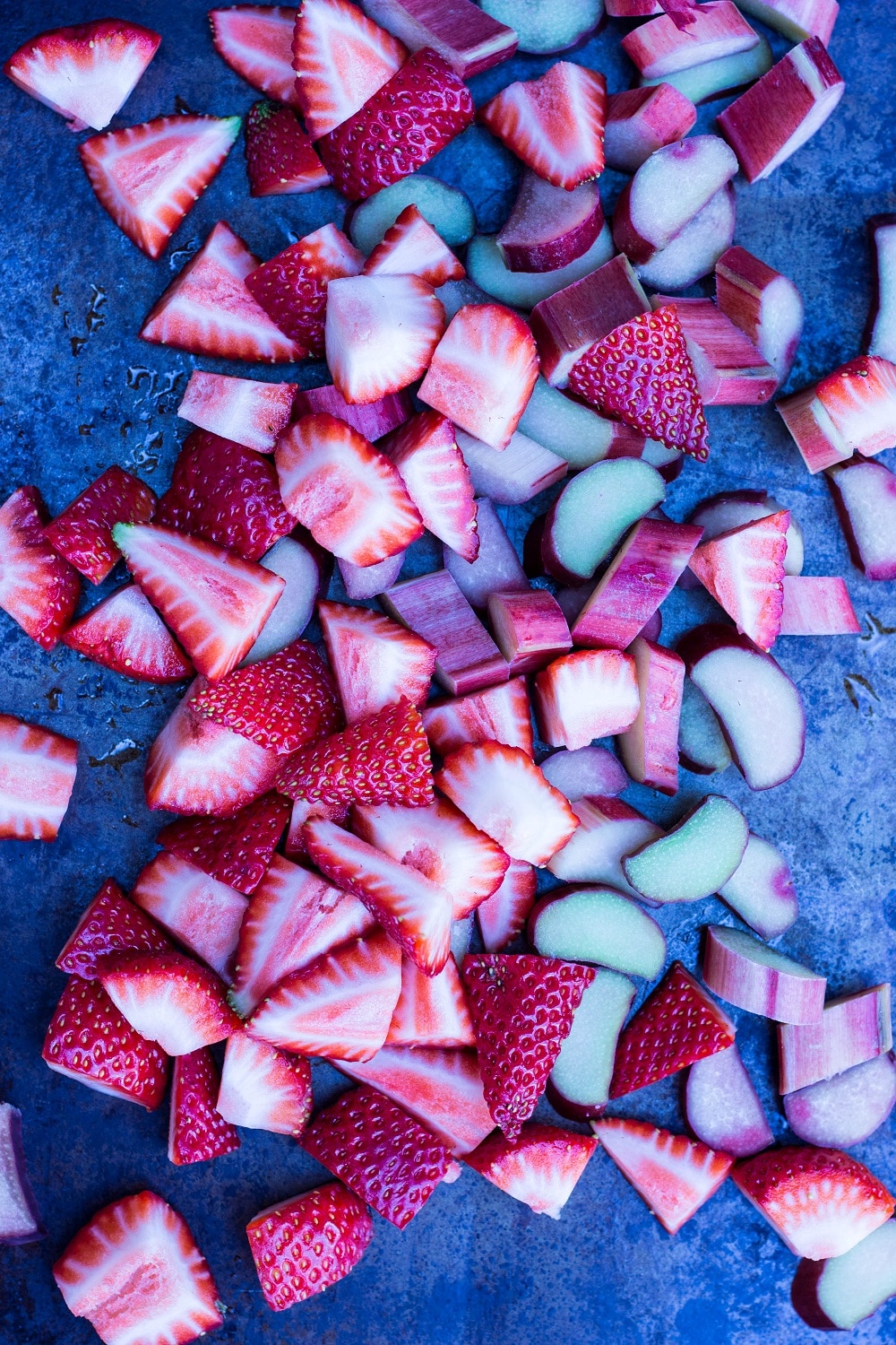 Strawberry Rhubarb & Lime Popsicle ingredients chopped up on a platter