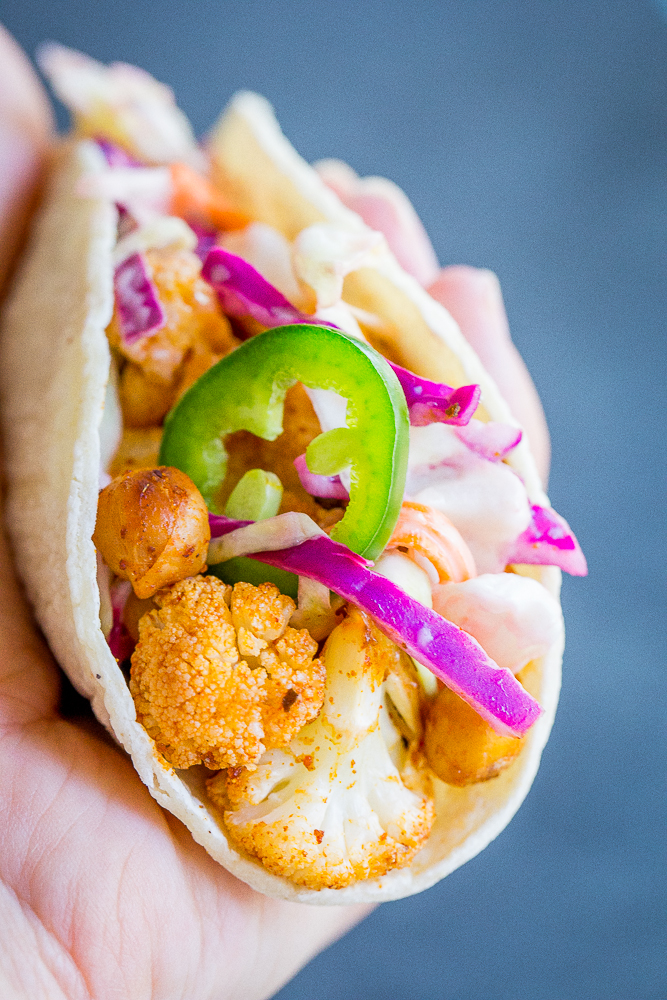 These BBQ Cauliflower and Chickpea Tacos with Creamy Lime Slaw are a delicious, filling and flavorful vegan dinner that everyone will love! They're so easy to make too! Gluten free/ vegan/ vegetarian/ dinner