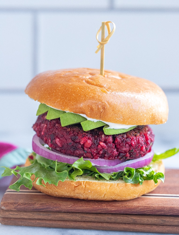 close up of a vegan beet burger with all the toppings