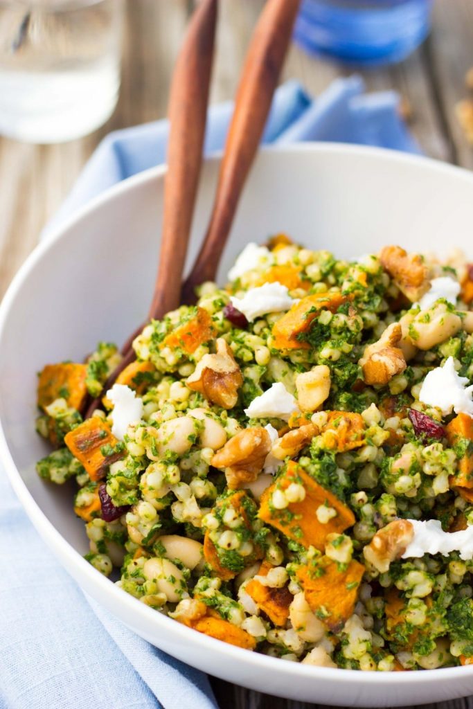 close up of a bowl of sorghum salad with sweet potato and black beans