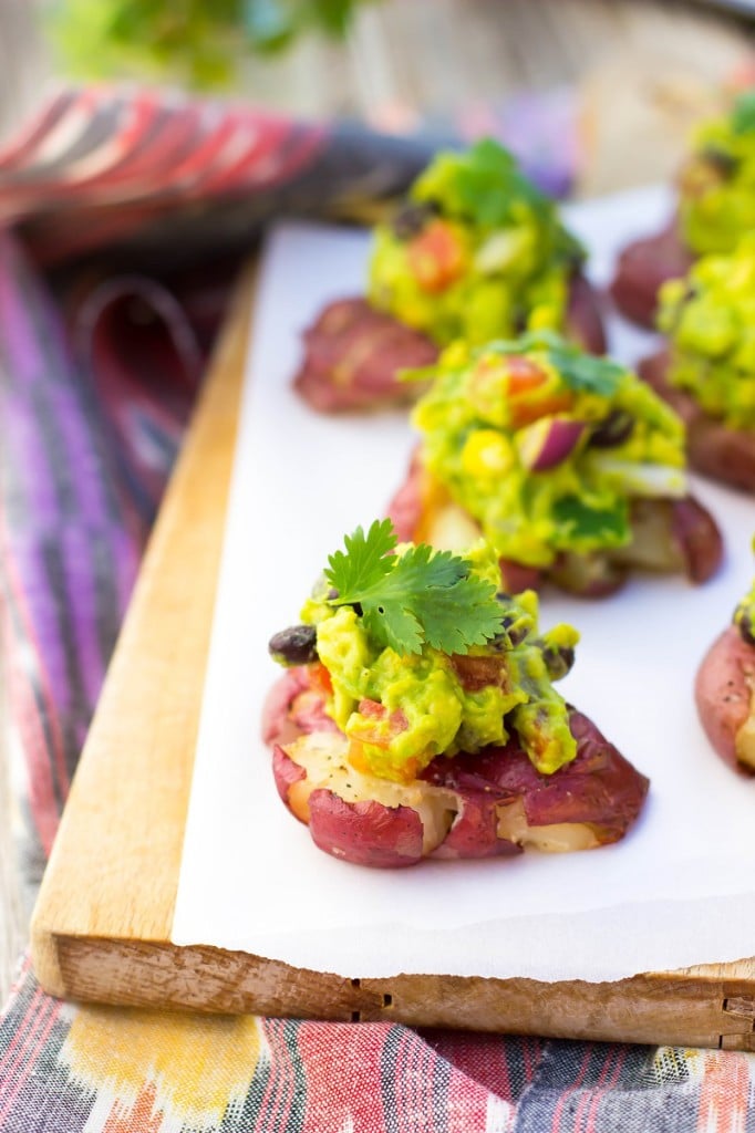 Smashed Potatoes with Loaded guacamole!  The perfect recipe for all your appetizer needs!