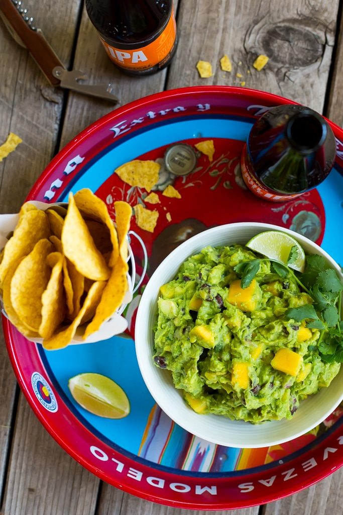 Mango Black Bean Guacamole-This delicious guacamole comes together in ten minutes and goes perfectly with so many things!