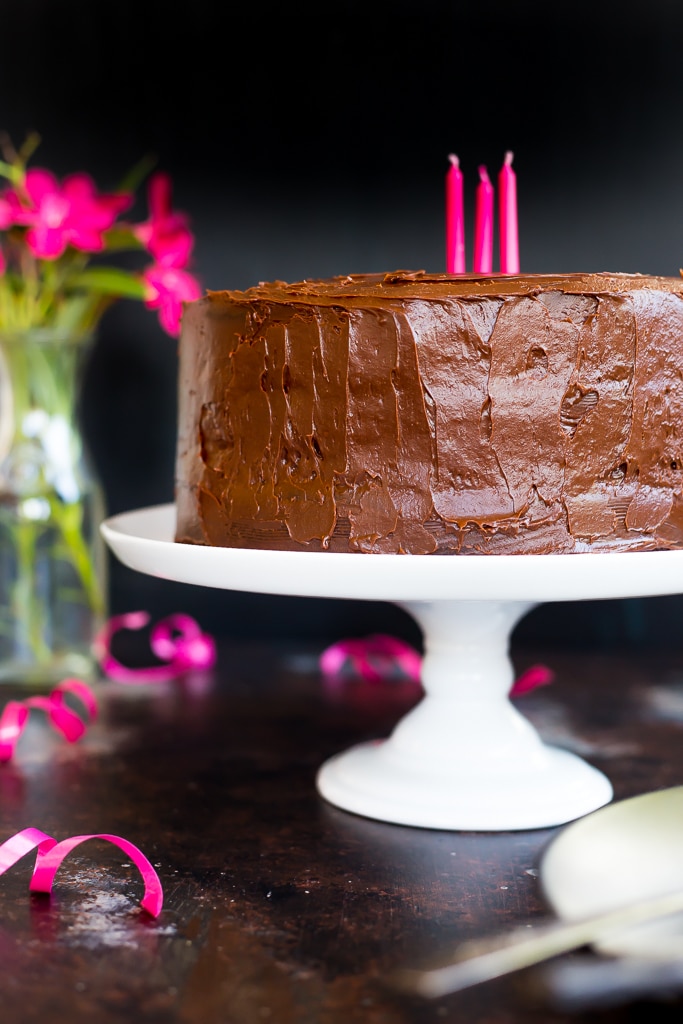 Gluten Free Chocolate Cake with pink candles in it