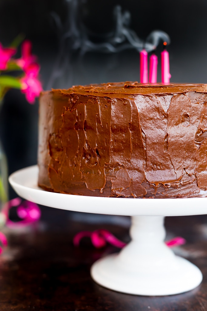 Easy Gluten Free chocolate cake with pink candles in it