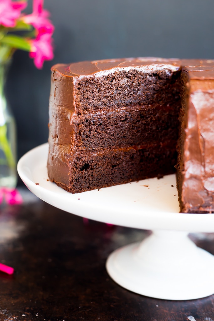 the best Gluten Free Chocolate Cake with a slice taken out of it