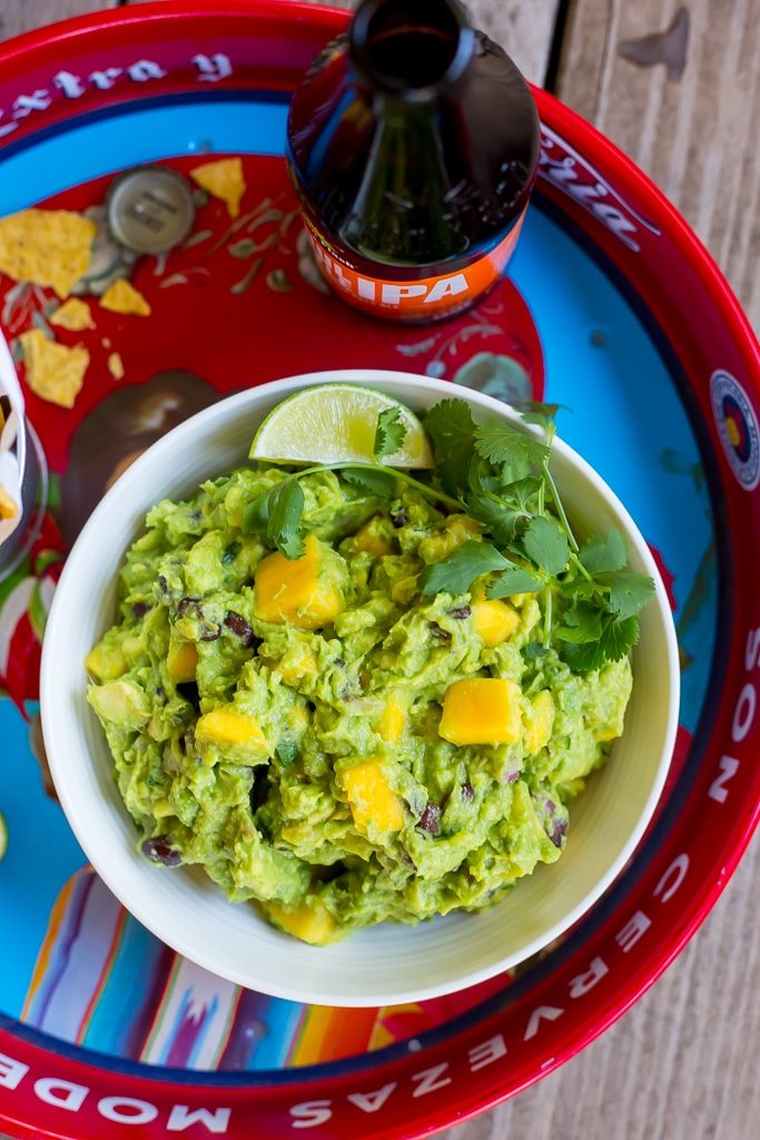 Mango Black Bean Guacamole-This delicious guacamole comes together in ten minutes and goes perfectly with so many things!