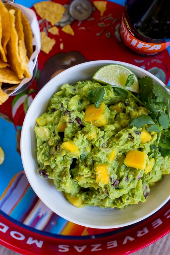 Mango Black Bean Guacamole-This delicious guacamole comes together in ten minutes and goes perfectly with so many things!