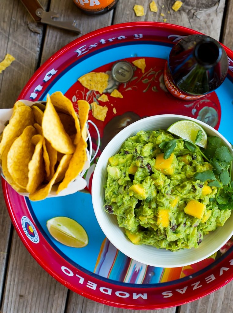 Mango Black Bean Guacamole-This delicious guacamole comes together in ten minutes and goes perfectly with so many things!