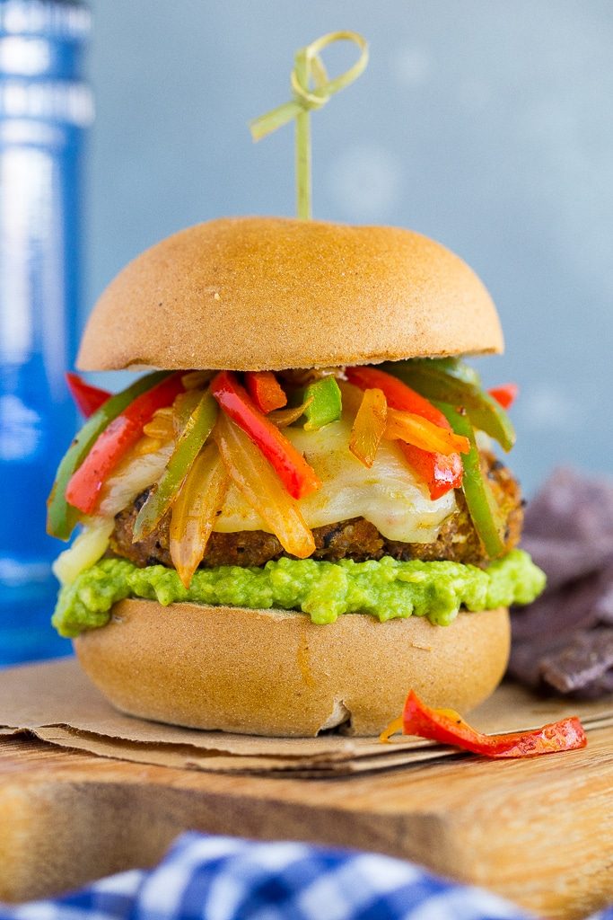 Jazz up your veggie burgers by making these Black Bean Fajita Veggie Burgers!  Topped with fajita peppers and onions, pepperjack cheese and guacamole! {gluten free}