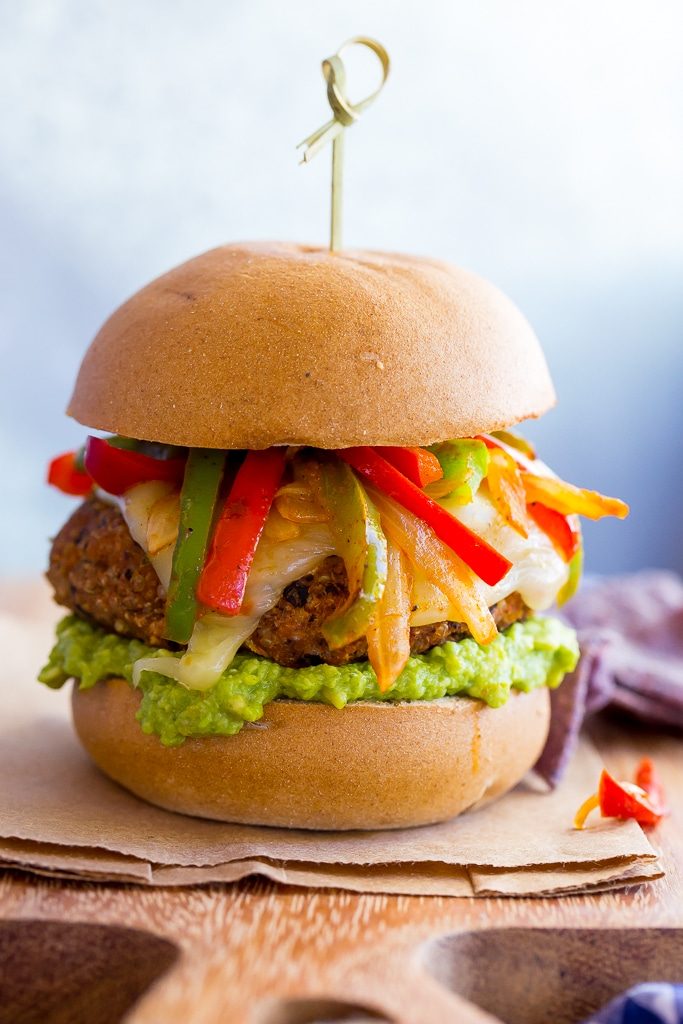 Jazz up your veggie burgers by making these Black Bean Fajita Veggie Burgers!  Topped with fajita peppers and onions, pepperjack cheese and guacamole! {gluten free}