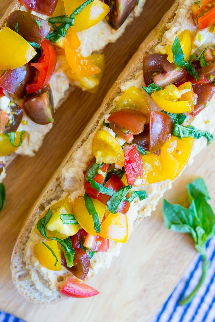 This Roasted Garlic Hummus Bruschetta is a delicious snack that is packed with so much fresh flavor! {gluten free, vegan}