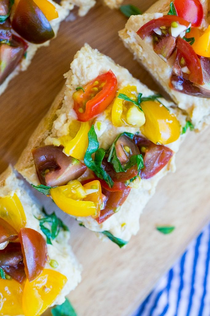 This Roasted Garlic Hummus Bruschetta is a delicious snack that is packed with so much fresh flavor! {gluten free, vegan}