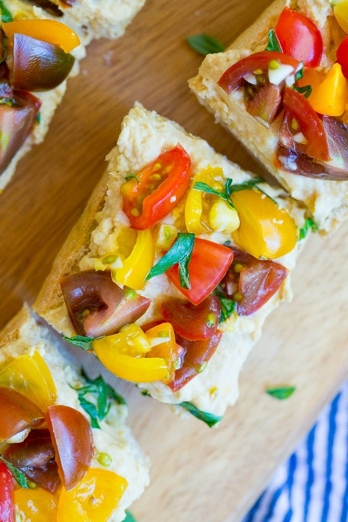 This Roasted Garlic Hummus Bruschetta is a delicious snack that is packed with so much fresh flavor! {gluten free, vegan}