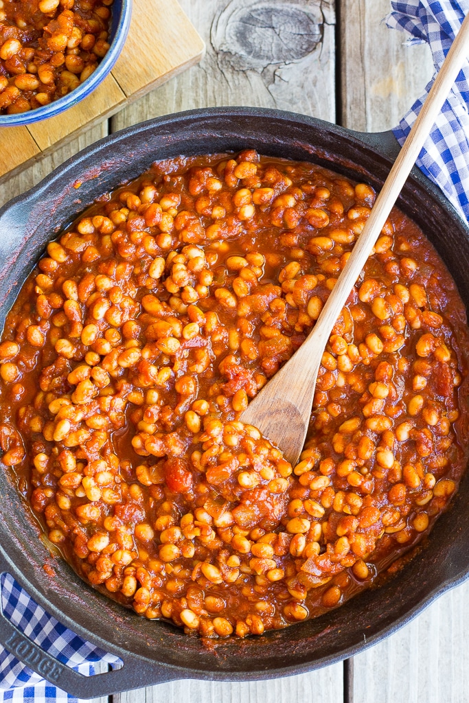 cast iron skillet full of stovetop baked beans