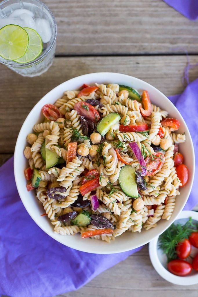 This Creamy Tahini Greek Pasta Salad is so easy to make and perfect for lunch!  It's vegan, gluten free and full of delicious vegetables and creamy pasta!