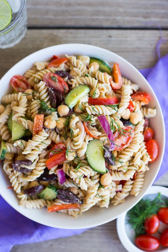 This Creamy Tahini Greek Pasta Salad is so easy to make and perfect for lunch!  It's vegan, gluten free and full of delicious vegetables and creamy pasta!