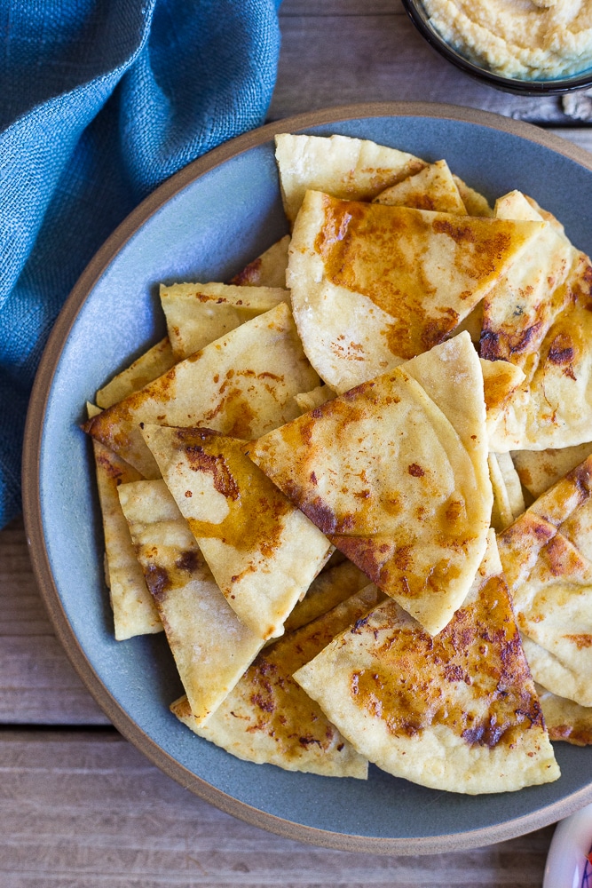 This Pan Fried Pita Bread comes together in minutes and will make you never want to eat plain pita bread again! It goes great with hummus and vegetables!