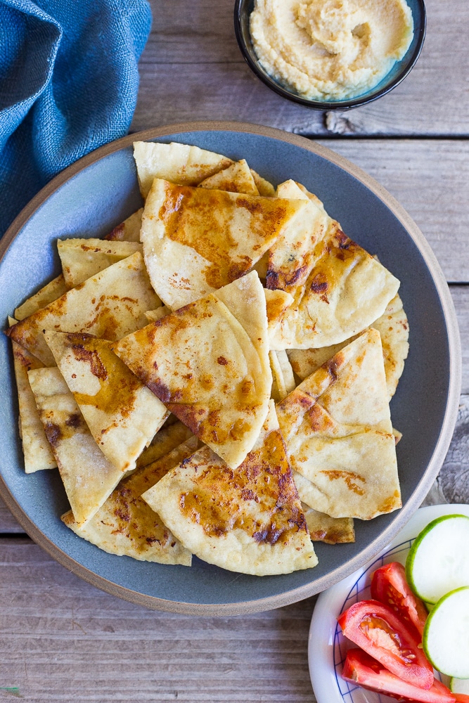 This Pan Fried Pita Bread comes together in minutes and will make you never want to eat plain pita bread again! It goes great with hummus and vegetables!