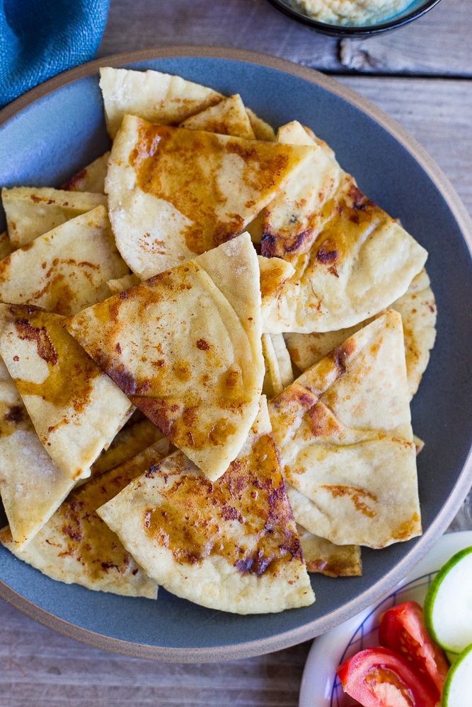 This Pan Fried Pita Bread comes together in minutes and will make you never want to eat plain pita bread again! It goes great with hummus and vegetables!