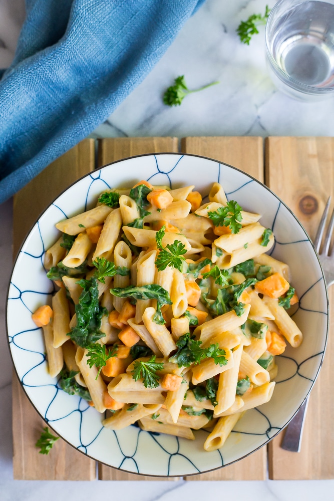 This delicious Creamy White Bean Pasta with Sweet Potato and Kale is so easy to make and comes together in only 30 minutes!  It's the perfect vegetarian dish for a weeknight dinner!  Gluten free and vegan too!