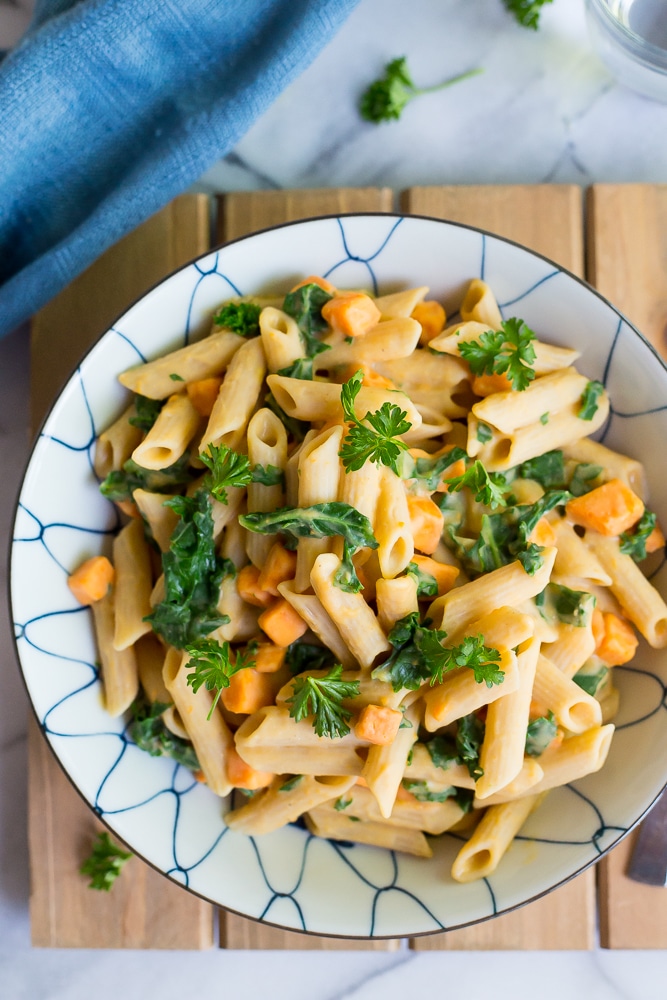 This delicious Creamy White Bean Pasta with Sweet Potato and Kale is so easy to make and comes together in only 30 minutes!  It's the perfect vegetarian dish for a weeknight dinner!  Gluten free and vegan too!
