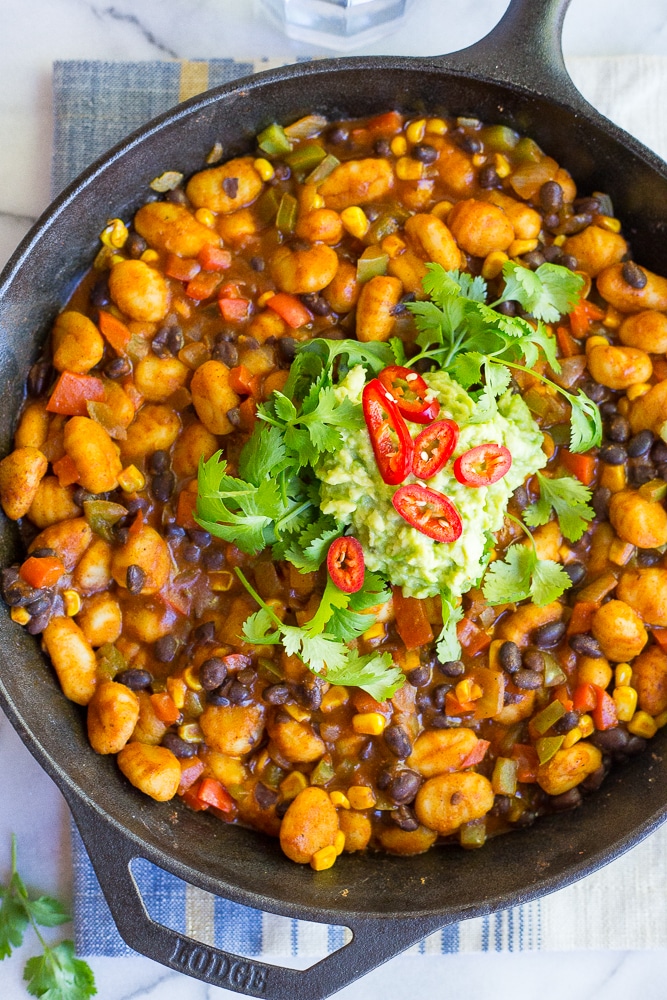 This Gnocchi Enchilada Skillet comes together in only 30 minutes and required just one pan! It's a great weeknight dinner with tons of flavor! Gluten free and vegan too!