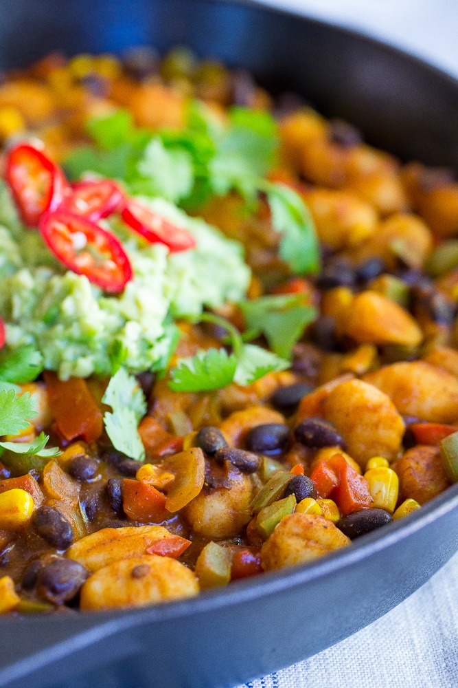 This Gnocchi Enchilada Skillet comes together in only 30 minutes and required just one pan! It's a great weeknight dinner with tons of flavor! Gluten free and vegan too!