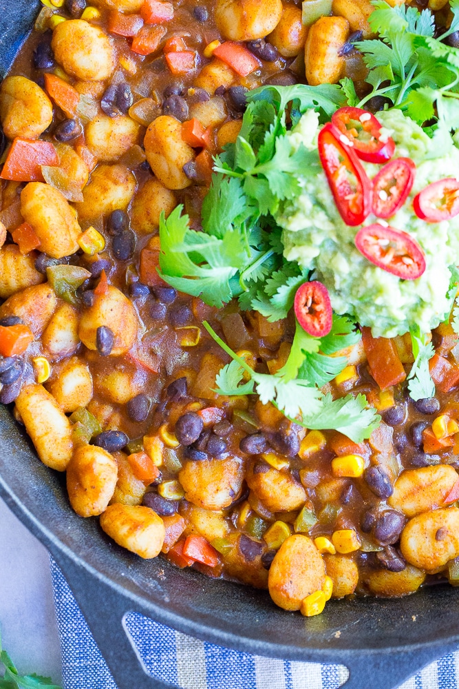 This Gnocchi Enchilada Skillet comes together in only 30 minutes and required just one pan! It's a great weeknight dinner with tons of flavor! Gluten free and vegan too!