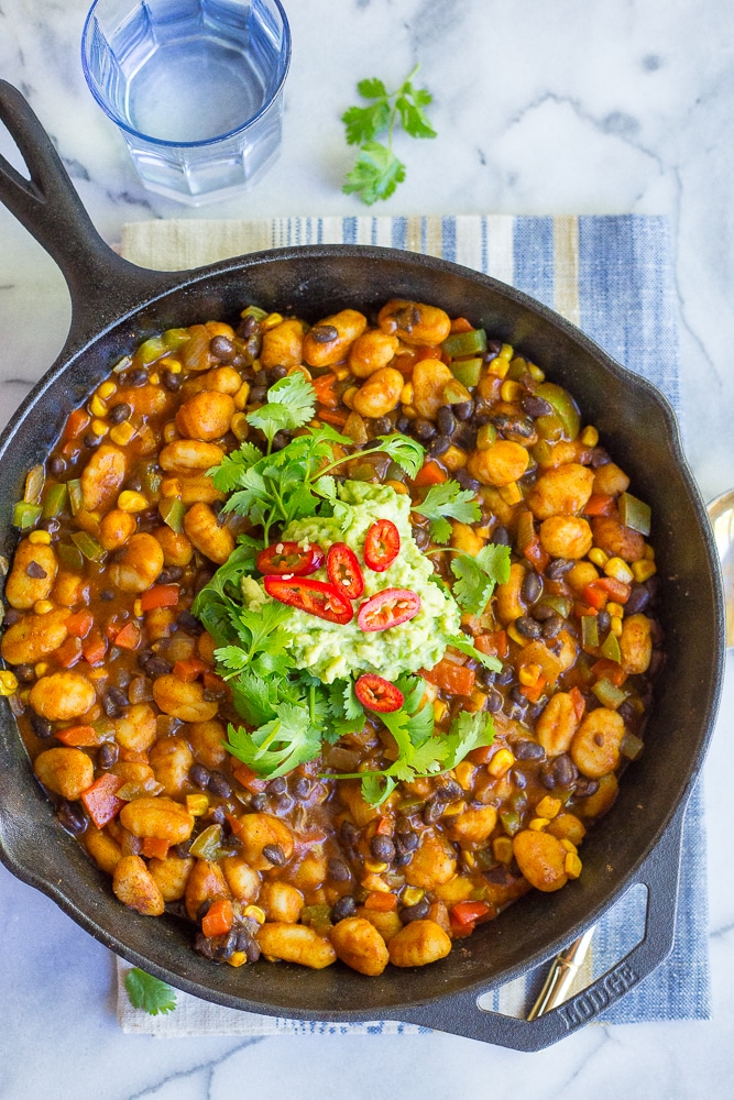 This Gnocchi Enchilada Skillet comes together in only 30 minutes and required just one pan! It's a great weeknight dinner with tons of flavor! Gluten free and vegan too!
