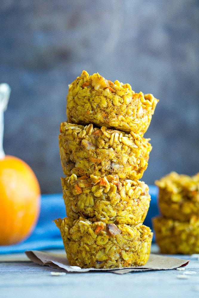 These Healthy Pumpkin and Carrot Baked Oatmeal Cups are perfect for a freezer friendly make ahead breakfast that is easy to grab and go with! Vegan and gluten free too!