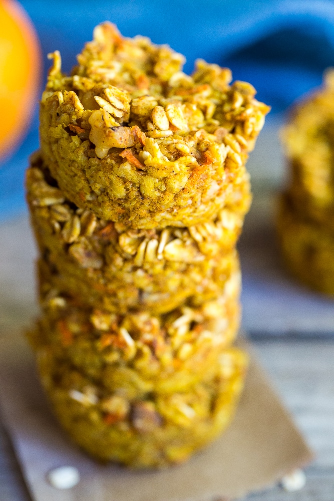 These Healthy Pumpkin and Carrot Baked Oatmeal Cups are perfect for a freezer friendly make ahead breakfast that is easy to grab and go with! Vegan and gluten free too!