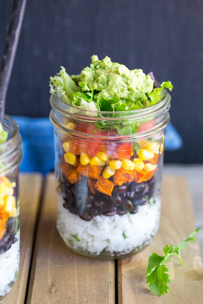 These Vegetarian Mason Jar Burrito Bowls can be made ahead of time and eaten for lunches or dinner!  Easy to assemble and lots of great flavors!  Vegan and gluten free.