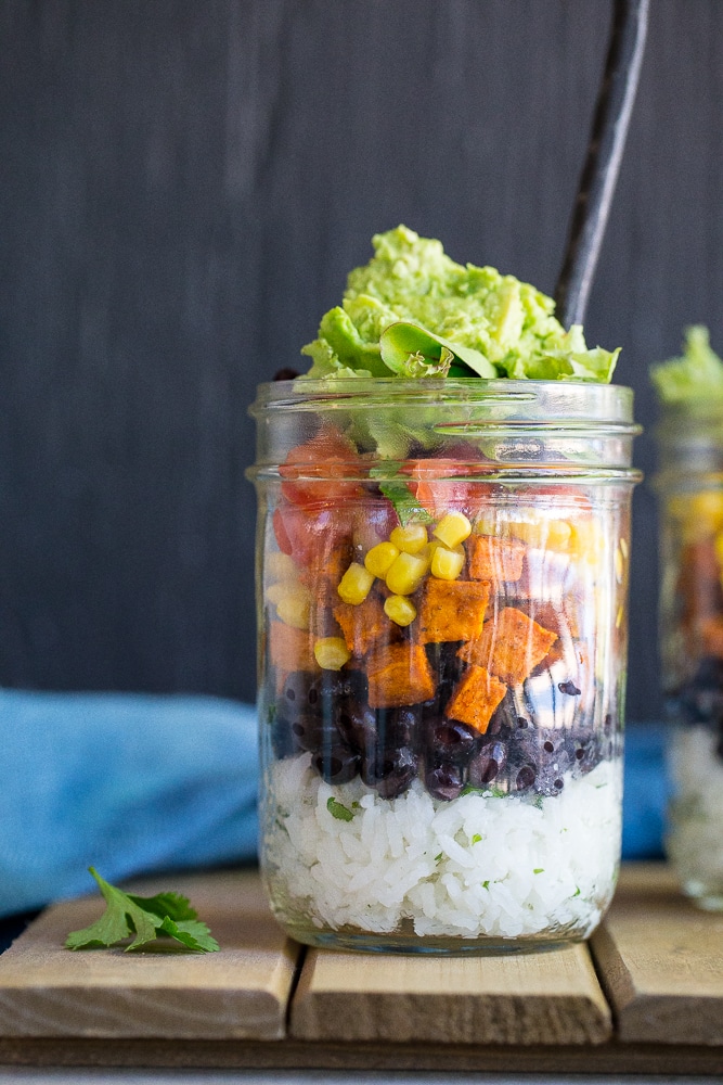These Vegetarian Mason Jar Burrito Bowls can be made ahead of time and eaten for lunches or dinner!  Easy to assemble and lots of great flavors!  Vegan and gluten free.