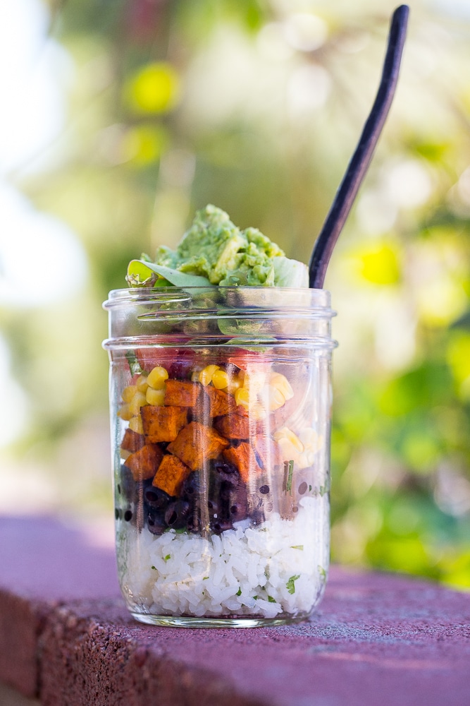 These Vegetarian Mason Jar Burrito Bowls can be made ahead of time and eaten for lunches or dinner!  Easy to assemble and lots of great flavors!  Vegan and gluten free.