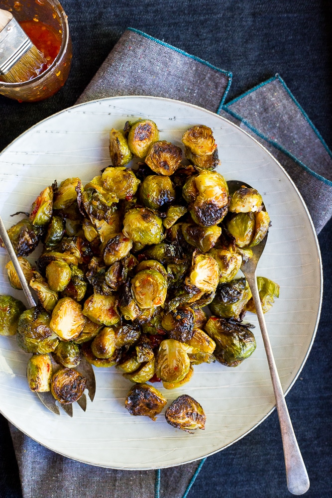 These Sweet Chili Roasted Brussels Sprouts are the perfect way to mix up your traditional brussels sprouts!  They're the perfect side dish!  Vegan and gluten free