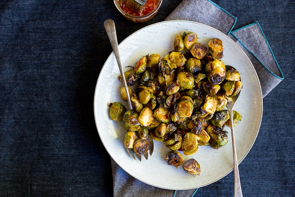 These Sweet Chili Roasted Brussels Sprouts are the perfect way to mix up your traditional brussels sprouts!  They're the perfect side dish!  Vegan and gluten free