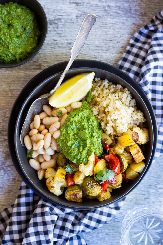 These Roasted Veggie Buddha Bowls are so healthy and delicious!  Just put everything in one bowl for a perfect comfort food dinner!  All topped off with some refreshing pesto.  Gluten free and vegan!