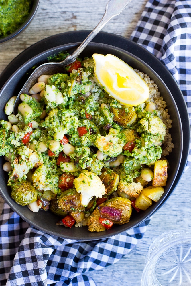 These Roasted Veggie Buddha Bowls are so healthy and delicious!  Just put everything in one bowl for a perfect comfort food dinner!  All topped off with some refreshing pesto.  Gluten free and vegan!