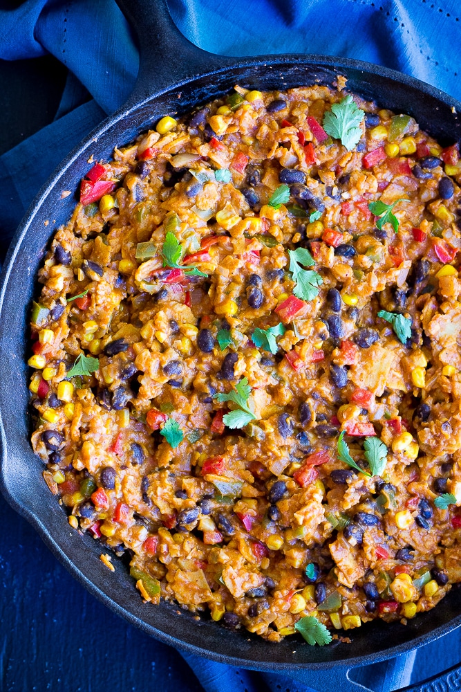 Easy Stove Top Enchiladas with Cauliflower Rice - This delicious vegetarian dinner recipe is packed with vegetables making it a really healthy option that everyone will love!  Comes together in no time for a quick and easy weeknight dinner!  Vegan and gluten free!