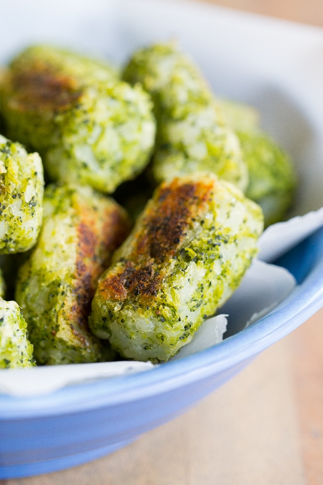 These 4 Ingredient Broccoli Tater Tots are packed with tons of broccoli and baked in the oven making them a really healthy side dish or snack!  A perfect way to get some extra veggies into your life!  Vegan and gluten free!