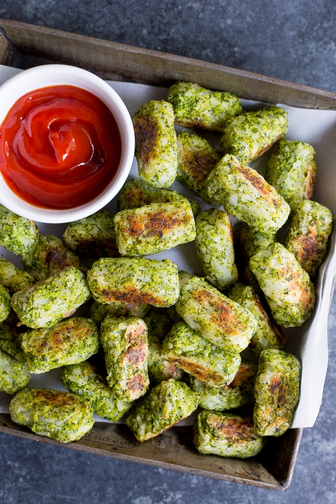 These 4 Ingredient Broccoli Tater Tots are packed with tons of broccoli and baked in the oven making them a really healthy side dish or snack!  A perfect way to get some extra veggies into your life!  Vegan and gluten free!