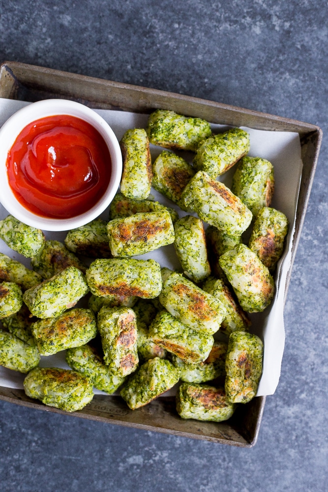 These 4 Ingredient Broccoli Tater Tots are packed with tons of broccoli and baked in the oven making them a really healthy side dish or snack!  A perfect way to get some extra veggies into your life!  Vegan and gluten free!