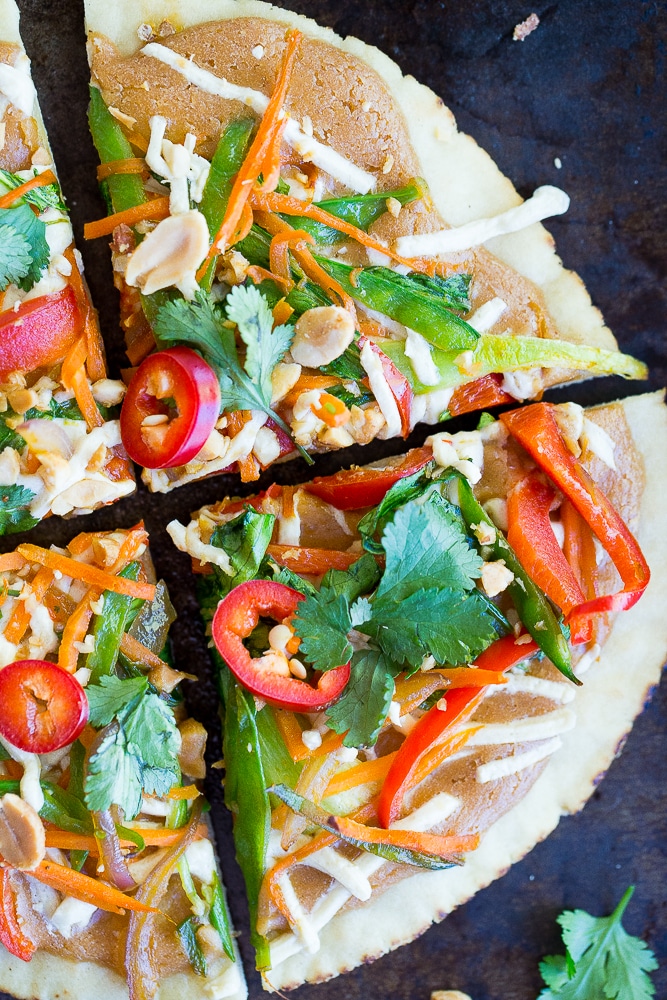 These Easy Thai Vegetable Pita Pizzas only take 30 minutes to make and are great for a delicious vegetarian weeknight dinner!  Gluten free and vegan option too!