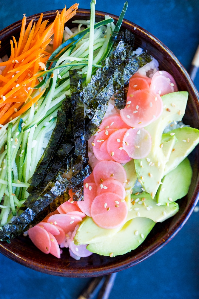 These Veggie Sushi Bowls with Quick Pickled Radishes come together really quickly for a delicious and healthy meal!  Eat them for dinner or make them as a lunch meal prep idea!  Vegan and gluten free!