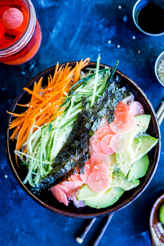 These Veggie Sushi Bowls with Quick Pickled Radishes come together really quickly for a delicious and healthy meal!  Eat them for dinner or make them as a lunch meal prep idea!  Vegan and gluten free!