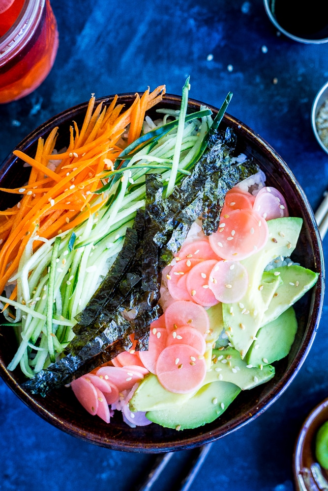 These Veggie Sushi Bowls with Quick Pickled Radishes come together really quickly for a delicious and healthy meal!  Eat them for dinner or make them as a lunch meal prep idea!  Vegan and gluten free!