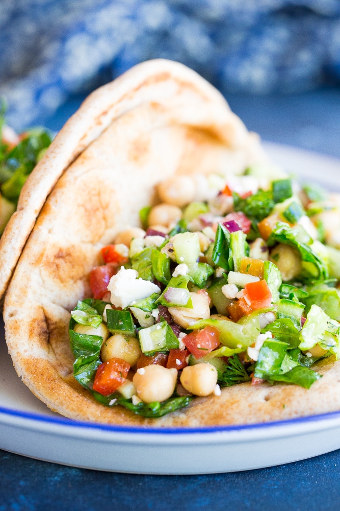 Mediterranean Chopped Salad Pitas- These delicious pitas are quick and easy to make and full of fresh vegetables. Perfect for a healthy lunch or no cook summer dinner!