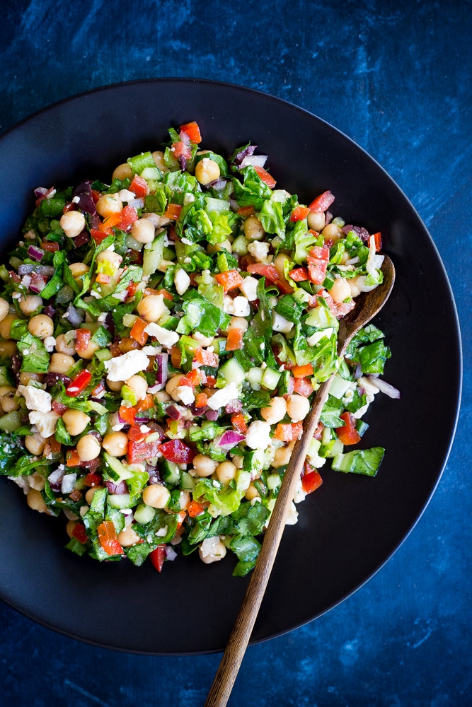 Mediterranean Chopped Salad Pitas- These delicious pitas are quick and easy to make and full of fresh vegetables. Perfect for a healthy lunch or no cook summer dinner!