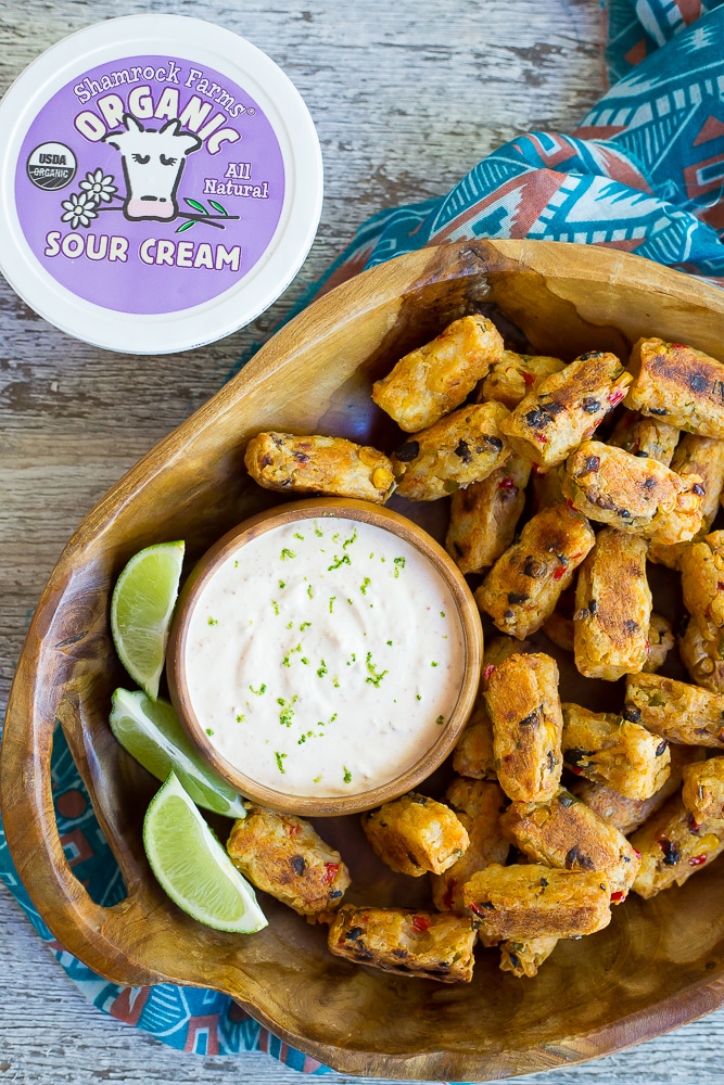 Tex Mex Tater Tots with Creamy Chipotle Lime Dip- Baked to perfection for a healthy and flavorful side dish! Dipped into a creamy and tangy dip! You'll never buy frozen tater tots again after you make your own! Gluten free, vegetarian